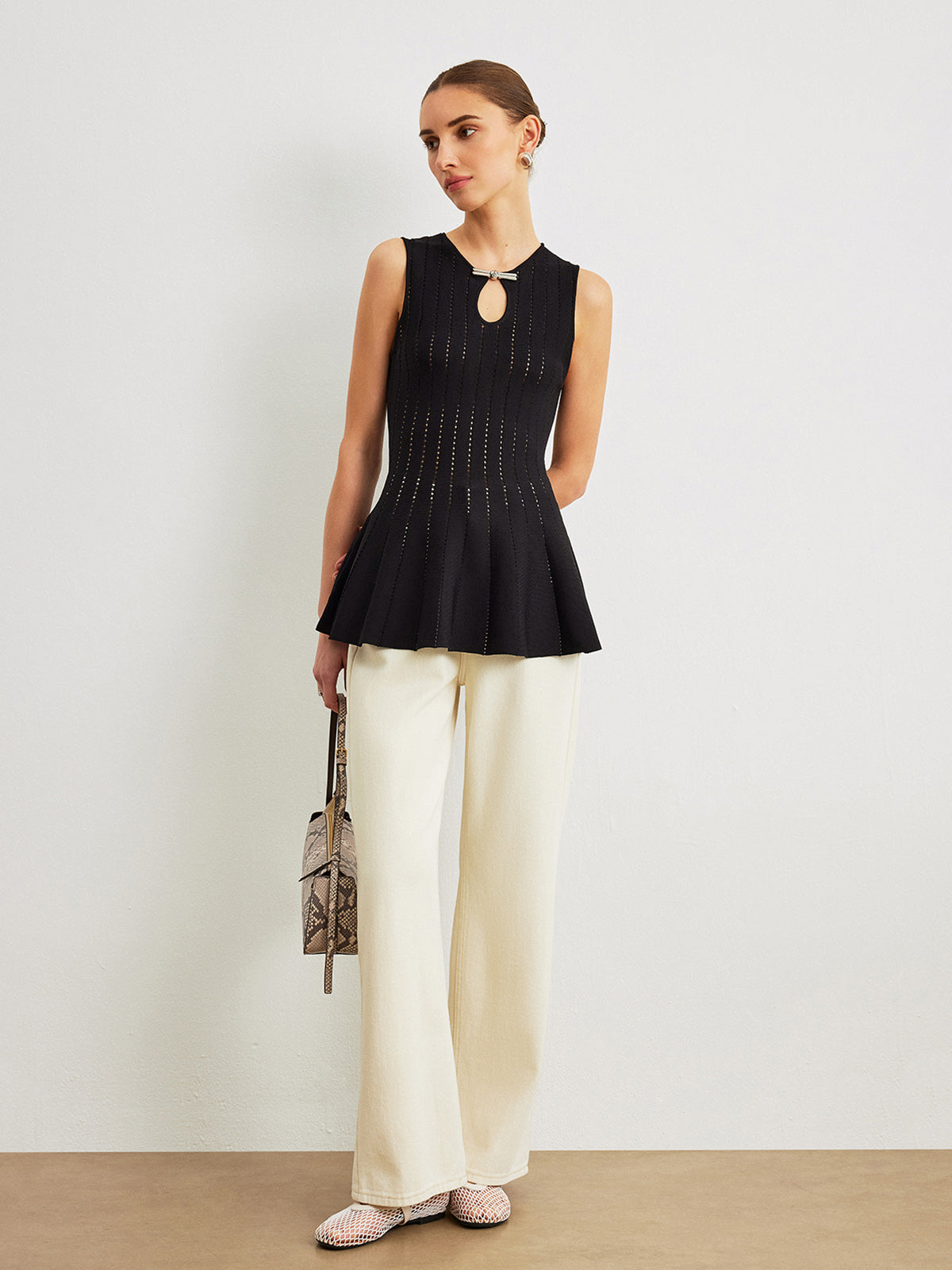 Semi-Sheer Knit Peplum Top With Bow Detail